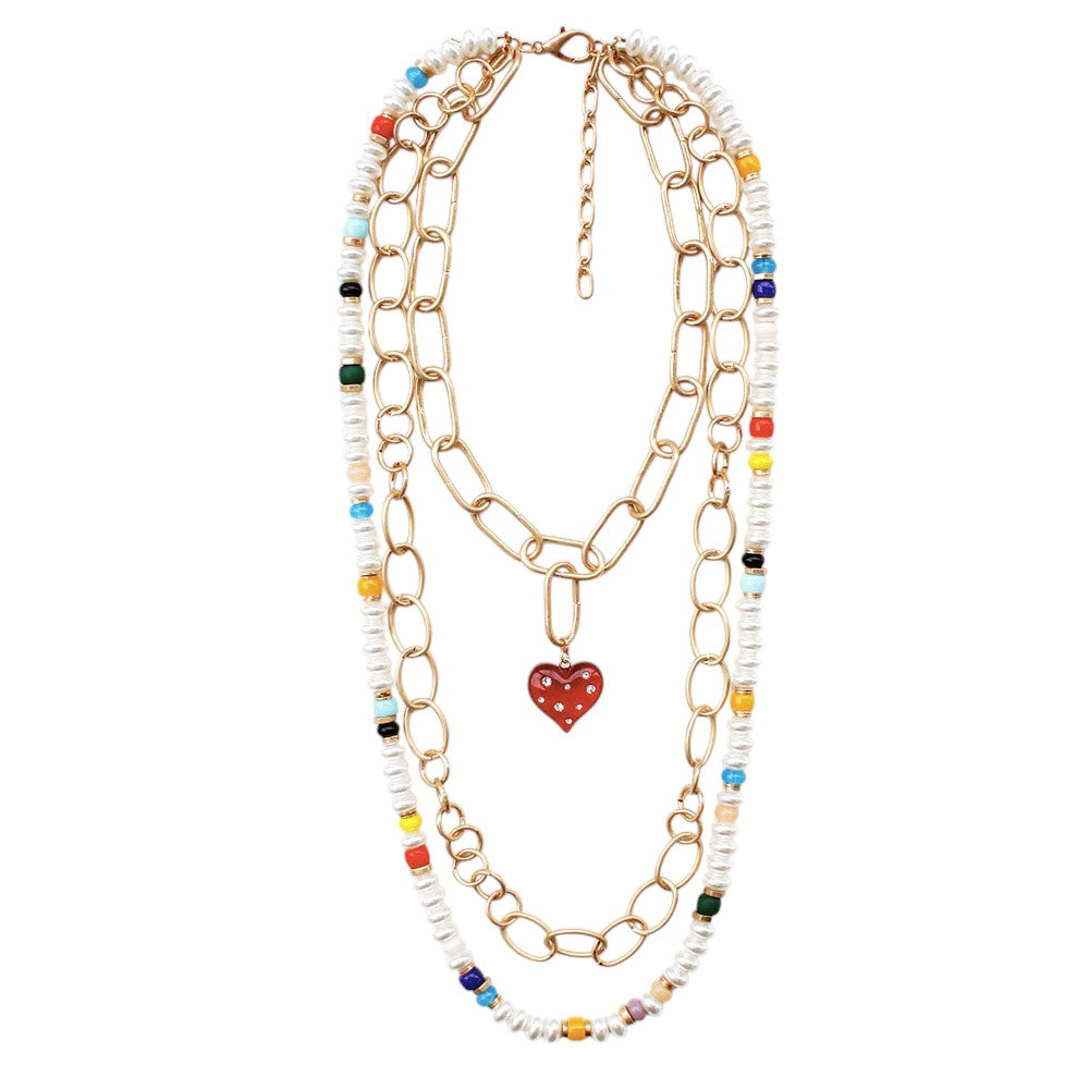 Multi Heart Pendant Accented Pearl Resin Beaded Triple Layered Necklace adds a touch of elegance and sophistication to any outfit. The heart pendant adds a sentimental touch, while the layered design creates a bold and eye-catching look. Made with high-quality materials, this necklace is both beautiful and durable.