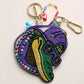 Multi Playful zipper pouch featuring a detailed alligator character design inspired by Mardi Gras festivities. Ideal for storing cosmetics, coins, or small essentials, this novelty pouch adds bold personality to seasonal displays, gift shops, party assortments, and festival-themed retail collections while offering practical everyday organization.