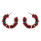 Celebrate the season with these festive tinsel hoop earrings, decorated with miniature ornament accents for a cheerful holiday touch. Lightweight and eye-catching, they’re perfect for adding playful flair to party outfits, winter gatherings, or seasonal celebrations.