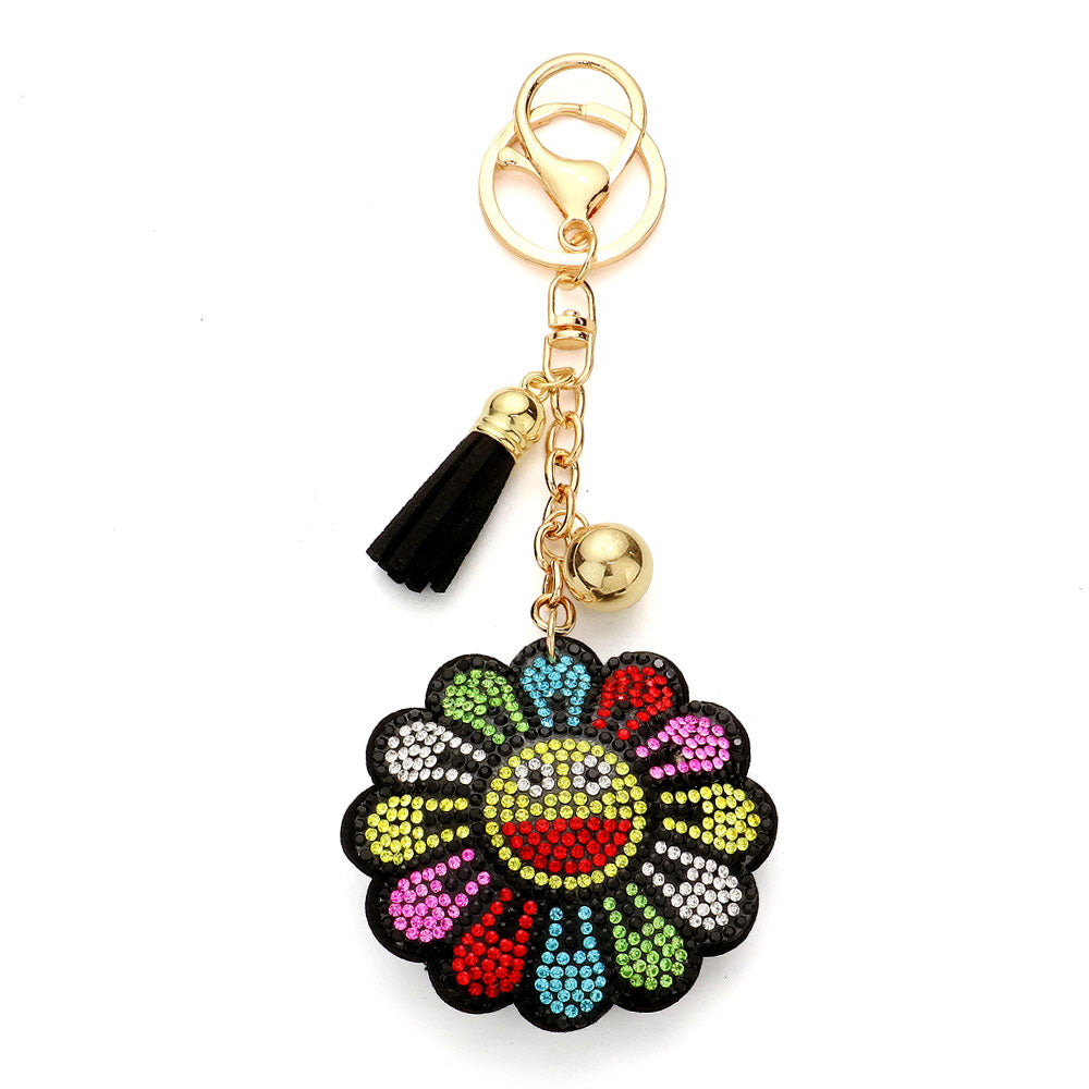 Multi Bling Smile Flower Tassel Bag Charm adds a touch of sparkle to your bag, while the flower design creates a fun and feminine look. The tassel adds movement and charm. With its unique design and quality materials, it's the perfect accessory for any bag. 