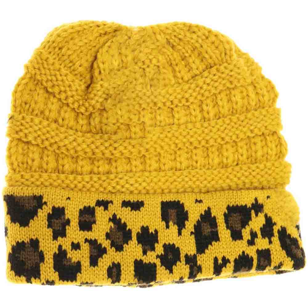 Mustard Kids Matching Cuff Leopard Print CC Beanie combines playful style with cozy warmth. Crafted from a soft knit fabric, this piece features a trendy leopard print pattern and a folded cuff accented by the classic CC logo. Ideal for chilly days, it keeps little heads comfortable while adding a fashionable touch to any outfit. Perfect for matching with adult styles, this beanie offers both practicality and a chic edge for young fashion enthusiasts. 