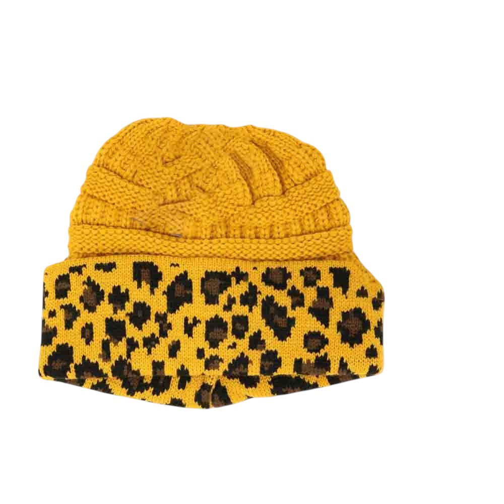 Mustard Matching Cuff Leopard Print CC Beanie Tail combines bold leopard patterning with a cozy cuff for an effortlessly stylish accessory. Designed with an extended tail shape, this beanie provides a comfortable fit while adding a fashionable edge to your cold-weather wardrobe. Its soft, durable fabric ensures warmth and long-lasting wear, making it a practical choice for everyday use with a distinctive flair. 