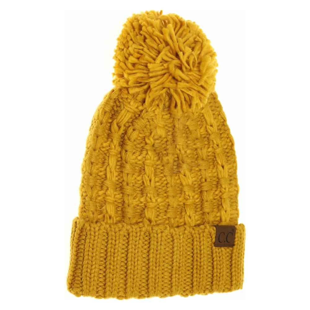 Mustard Slipstitch Pom Beanie expertly blends functional warmth with refined design. Crafted with a textured slipstitch knit, it ensures durability and a snug fit while maintaining breathability. The added pom offers a subtle yet distinctive accent, making this beanie an essential piece for both outdoor protection and polished winter style. 