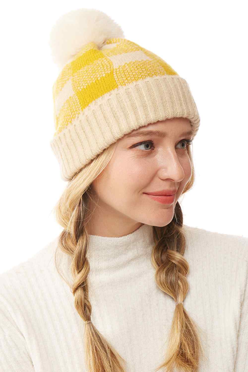 Mustard The Buffalo Check Beanie with Pom Pom features a classic plaid design that brings timeless style to your winter wardrobe. Made from soft, cozy knit fabric with a playful pom pom accent, it offers warmth, comfort, and a snug fit for chilly days.