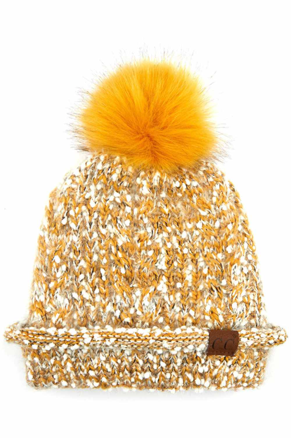 Mustard The C.C Eyelash Confetti Yarn Knit Beanie with Pom features soft eyelash yarn blended with subtle confetti flecks for a fun, textured look. Topped with a fluffy pom-pom, it delivers cozy warmth and a playful sparkle perfect for cold-weather styling.
