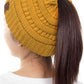 Mustard The C.C Solid Color Ponytail Messy Bun Beanie combines comfort with versatility for effortless everyday style. Crafted from 100% soft acrylic, this beanie features an open crown design that accommodates ponytails and messy buns while keeping you warm. The one-size-fits-most construction ensures a secure, flattering fit for virtually anyone. Perfect for casual outings, workouts, or relaxed weekends, this practical accessory transitions seamlessly from season to season.