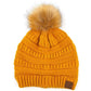 Mustard Stay warm and cozy with this classic C.C Pom Pom Knit Beanie, crafted from 100% soft acrylic for all-day comfort. The ribbed knit design adds texture and durability, while the signature pom pom on top brings a playful touch to any winter outfit. One size fits most, making it the perfect accessory for everyone. Ideal for cold weather adventures or casual everyday wear.