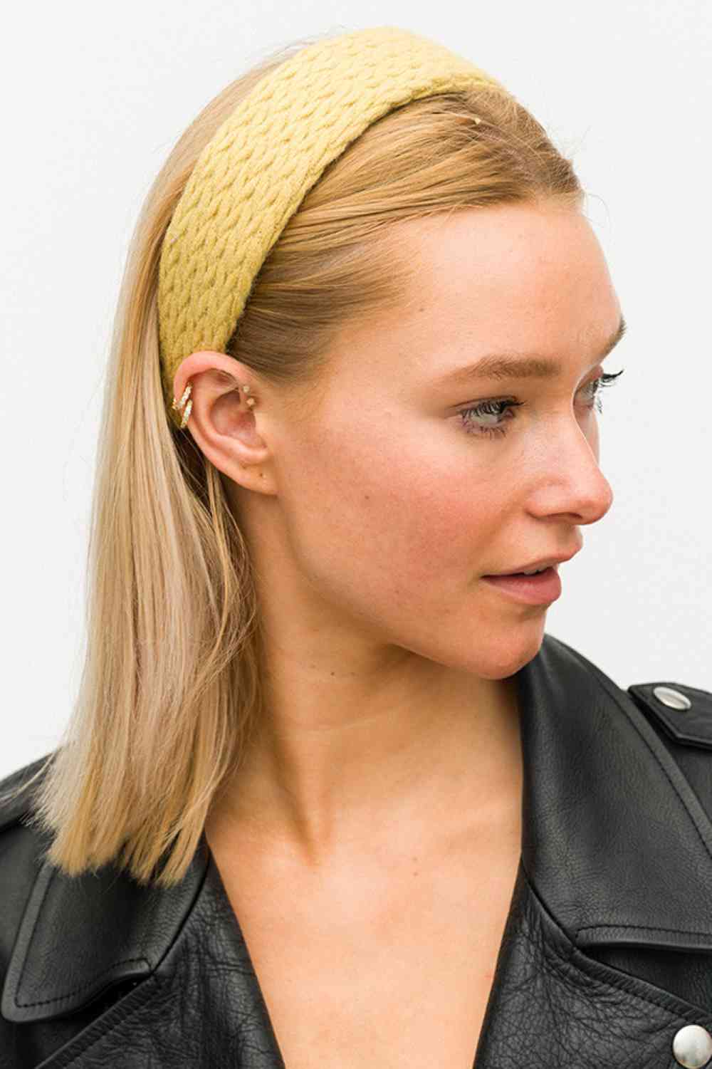 Mustard Stay warm and stylish with this classic knitted headband. Crafted from soft 100% polyester, it offers comfort and durability for everyday wear. The generous 2" x 17" size fits most head sizes perfectly, making it ideal for cold weather, workouts, or casual outings. Available in a pure, solid color that pairs effortlessly with any outfit. A versatile essential for your winter wardrobe.