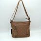 Quilted Nylon Crossbody Bag with Buckle Accents and Tassel Charm - Brown - Crossbody Bags