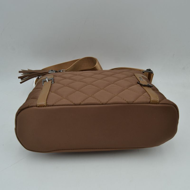 Quilted Nylon Crossbody Bag with Buckle Accents and Tassel Charm - Crossbody Bags
