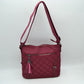 Quilted Nylon Crossbody Bag with Buckle Accents and Tassel Charm - Wine - Crossbody Bags
