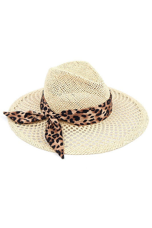Natural C. C Leopard Band Panama Hat is perfect for adding a touch of style to any outfit. With a trendy leopard print band, this hat is both fashionable and functional. Made with high-quality materials, it offers excellent sun protection and durability. Stay chic and protected with this must-have accessory. 