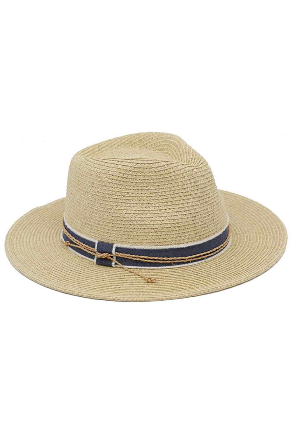 Natural Elevate your sun style with this classic straw fedora, crafted from a breathable 80% paper and 20% polyester blend. The sophisticated contrast ribbon paired with intricate braided cord detailing adds a refined touch to any warm-weather outfit. Built-in UPF 50+ protection shields your face and neck from harmful rays, making it as practical as it is fashionable. Perfect for beach days, garden parties, or casual outings. Lightweight and comfortable for all-day wear.