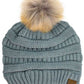 Natural Gray Stay warm and cozy with this classic C.C Pom Pom Knit Beanie, crafted from 100% soft acrylic for all-day comfort. The ribbed knit design adds texture and durability, while the signature pom pom on top brings a playful touch to any winter outfit. One size fits most, making it the perfect accessory for everyone. Ideal for cold weather adventures or casual everyday wear.