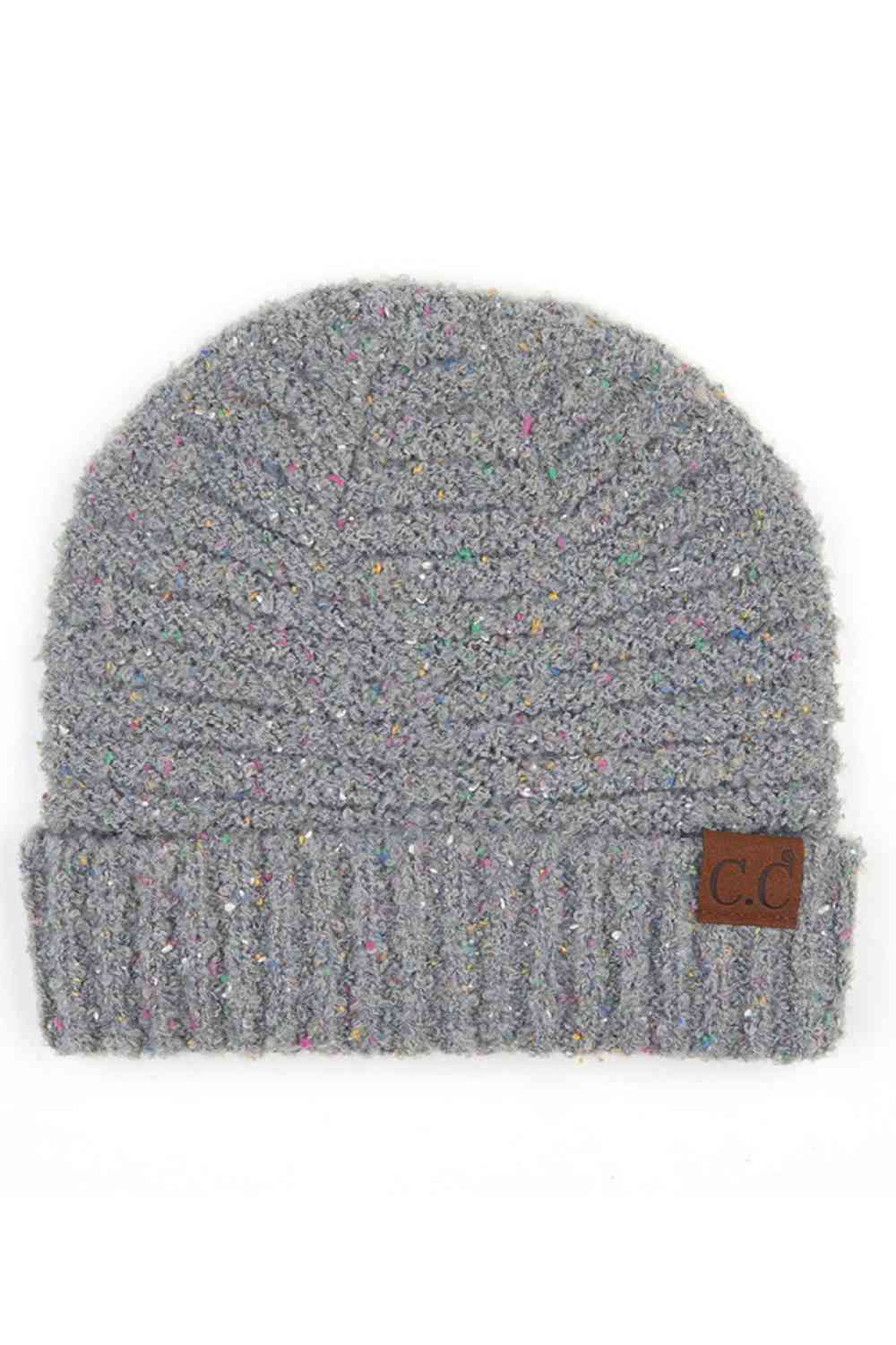 Natural Grey Elevate your winter wardrobe with this C.C Confetti Boucle Yarn Beanie, crafted from a premium blend of 95% polyester and 5% cotton. The textured boucle yarn creates visual interest and dimension, making it the perfect accessory to complement any outfit.