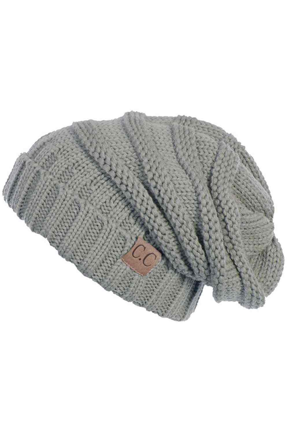 Grey Wrap yourself in warmth with this C.C Slouchy Knitted Beanie, crafted from 100% soft acrylic for ultimate comfort. The oversized silhouette and plush pom pom detail create a relaxed, on-trend look perfect for chilly days. Available in nine versatile colors—Beige, Berry, Dark Denim, Heather Gray, Ivory, Pistachio, Rose, Steel Blue, and Violet Purple—this beanie pairs effortlessly with any winter wardrobe. The ribbed knit construction ensures durability and a flattering fit. Hand wash and lay flat to dry