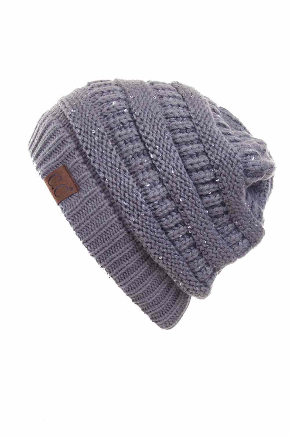 Grey C.C Sequin Ponytail Messy Bun Beanie with open top design lets you pull your hair through for a stylish, effortless look. Crafted from 100% soft acrylic, this cozy beanie keeps you warm while showcasing your ponytail or messy bun. The shimmering sequin detailing adds sparkle and dimension to your winter style. Perfect for casual days, outdoor activities, or layering under jackets. One size fits most for comfortable, versatile wear that works with any outfit.