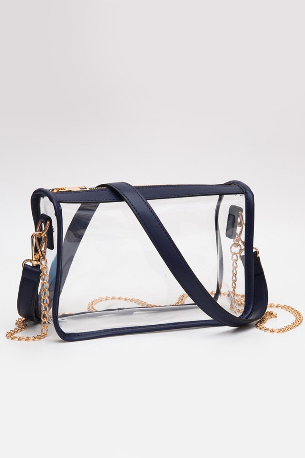 NAvy Clear Rectangle Stadium Concert Crossbody Bag offers a sleek, transparent design ideal for event security compliance. Its rectangular shape provides ample space for essentials while maintaining a compact profile. The adjustable crossbody strap ensures comfortable wear, making it perfect for concerts and stadium visits where quick access and visibility are essential. Durable materials guarantee longevity, combining practicality with modern style for hassle-free outings.