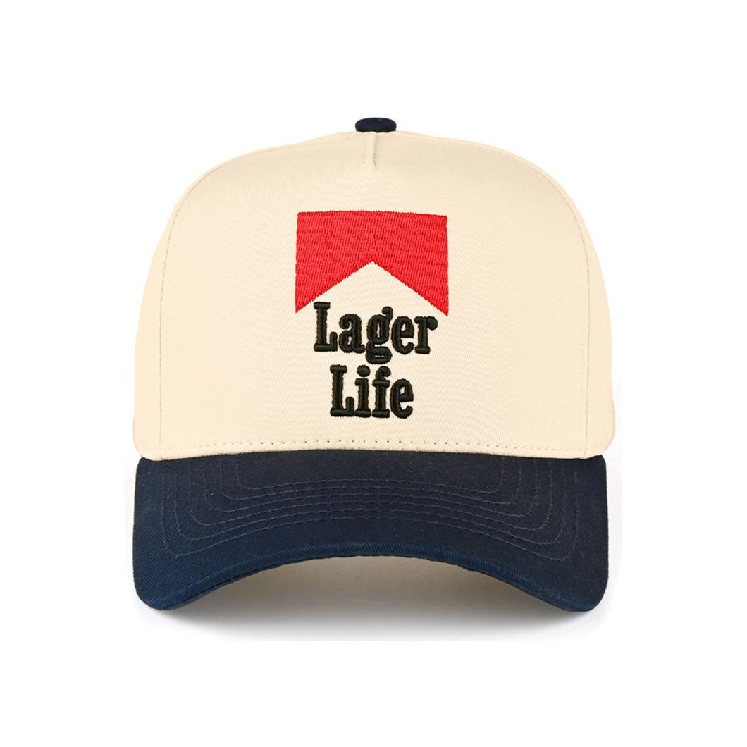 Navy CC Beanie “Lager Life” Letter Embroidered Two-Tone Trucker Hat Baseball Cap features bold embroidered lettering paired with a stylish two-tone design for a fun, casual look. Designed in a classic trucker style, it offers breathable comfort and an adjustable fit for everyday wear.