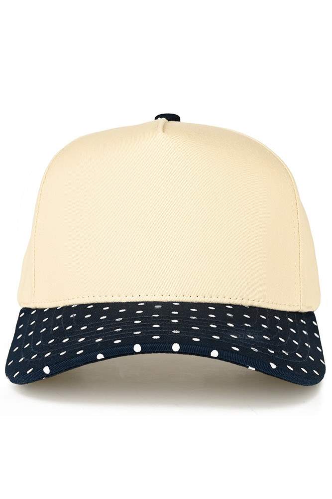 Classic style meets playful design with this C.C trucker hat. The small polka dot pattern adorns the brim, while the two-tone construction adds visual interest and versatility. Structured mesh panels provide breathability for all-day wear, making it perfect for casual outings, outdoor activities, or everyday comfort. The adjustable back ensures a secure fit for most head sizes. Whether you're heading to the beach, running errands, or just want a fun accessory, this hat delivers both style and function.