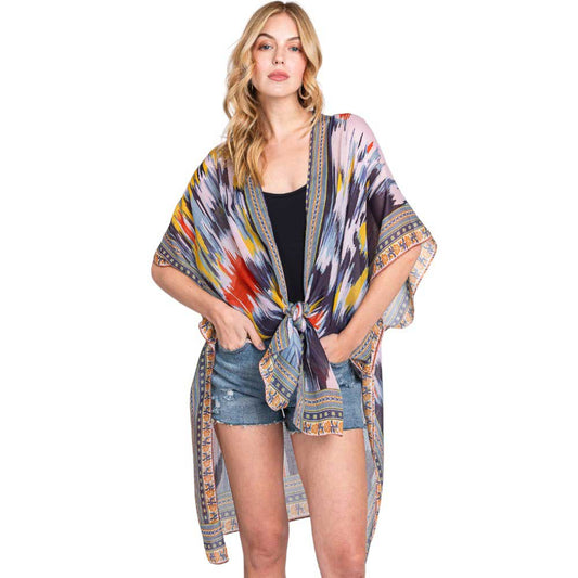 Navy Geometric Trim Tie Dye Print Kimono Poncho, Expertly crafted with a stylish geometric trim and tie dye print, our Kimono Poncho adds a touch of sophistication to any outfit. Versatile and trendy, this poncho is perfect for layering and can be dressed up or down for any occasion. Elevate your wardrobe with this piece.