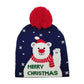 Navy Let it Snow Message Snowman Snowflake Pom Pom Beanie Hat. Stay cozy and stylish this winter season with this. Featuring a festive Christmas theme complete with a snowman, snowflakes, and a luxuriously soft pom pom, this beanie hat is perfect for cold-weather wear. Enjoy the utmost warmth and comfort all winter long.