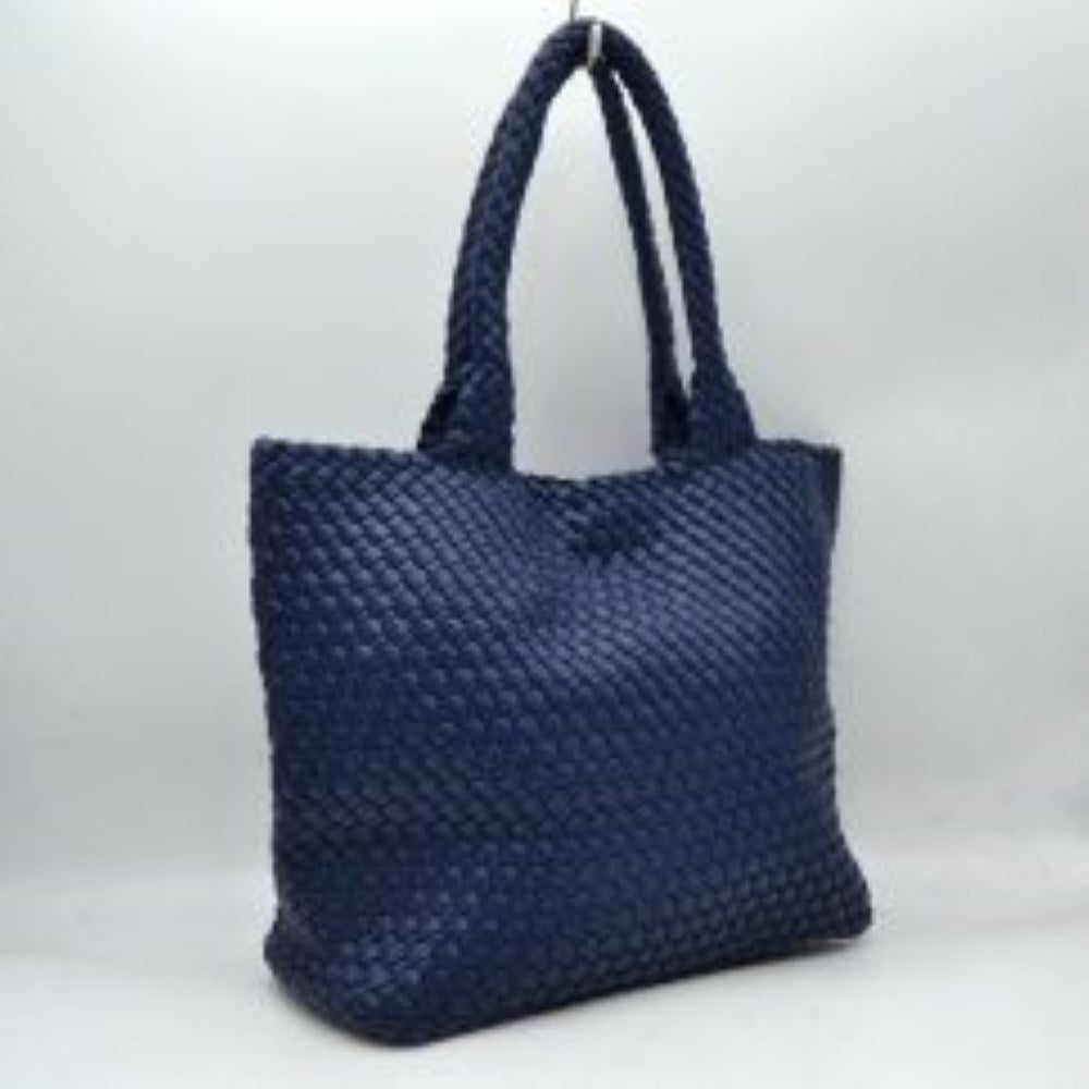 Navy-blue This structured tote bag features an intricate basket-weave design across its body and integrated shoulder straps, creating a textured look suitable for everyday use. The main storage compartment offers a wide, open-top design for easy access to daily essentials. Accompanying the larger bag is a matching smaller pouch with a distinct woven exterior pattern and a secure gold-tone top zipper closure to keep smaller items organized.