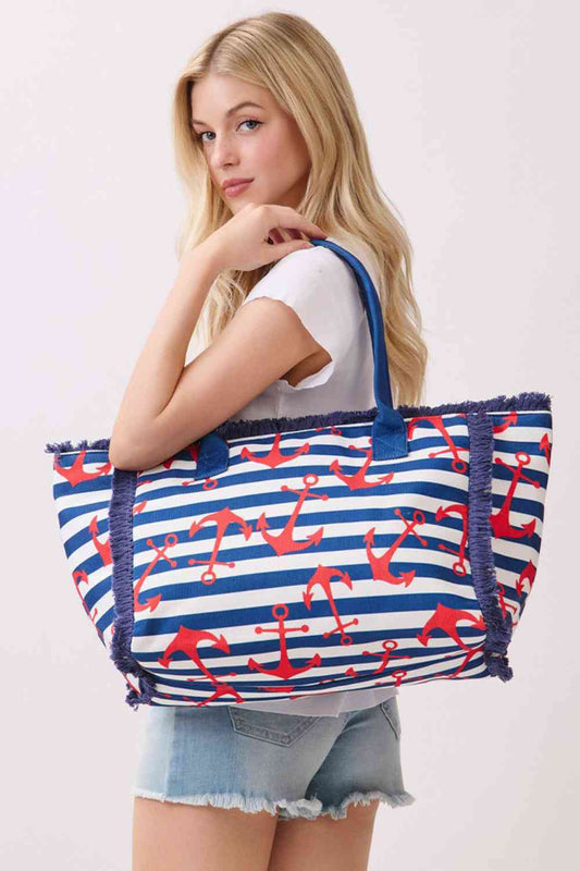 Navy Anchor with Stripes Pattern Fringe Medium Tote Bag Carry your essentials in style with this versatile medium tote. Featuring a classic anchor and stripe pattern with playful fringe detailing, it's the perfect companion for beach days, shopping trips, or everyday adventures. Crafted from durable 100% polyester, this tote measures 14.5" x 11.5" x 7" — spacious enough for all your needs. The secure zipper closure keeps your belongings safe, while the convenient inner pocket adds extra organization. Whethe
