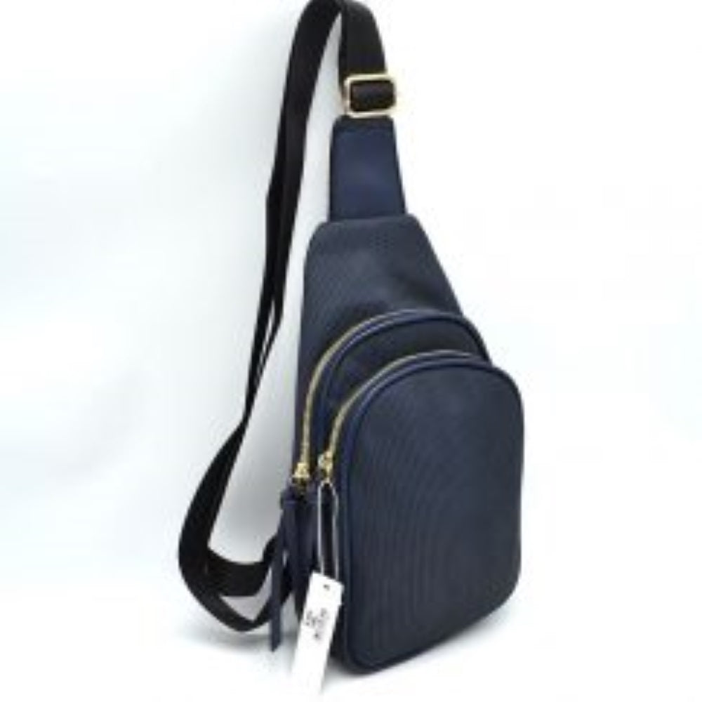 Navy-blue This practical sling bag features a textured, finely ribbed exterior w/ a tapered silhouette designed for comfortable everyday use. It offers organized storage compartments, including a curved main zippered section and a matching smaller front zippered pouch, both enhanced by elongated vertical tassel pulls hanging from the sliders. The bag is equipped w/ a single wide fabric shoulder strap attached to a smooth top panel & secured w/ a metallic adjustment buckle to easily customize the carrying 