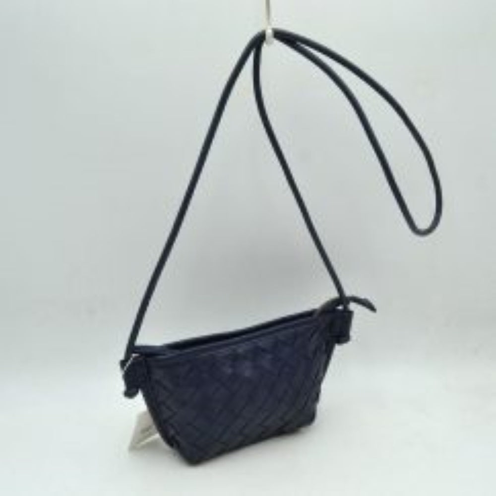Navy blue This small crossbody bag features a distinct woven texture across the main body, providing visual interest. A slim, round cord strap, attached with unique knot details, enables comfortable everyday wear. The compact design secures with a top zipper closure, complete with a practical zipper pull, keeping essentials safe and easily accessible within the main compartment.