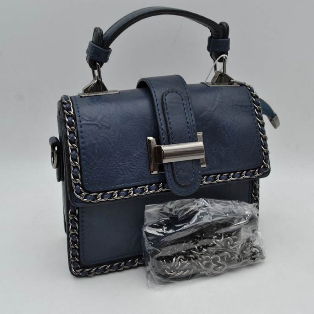 Navy Add a touch of structured elegance to your look with this chic top-handle satchel bag. Designed for the modern trendsetter, it seamlessly blends classic vintage vibes with contemporary edgy accents.