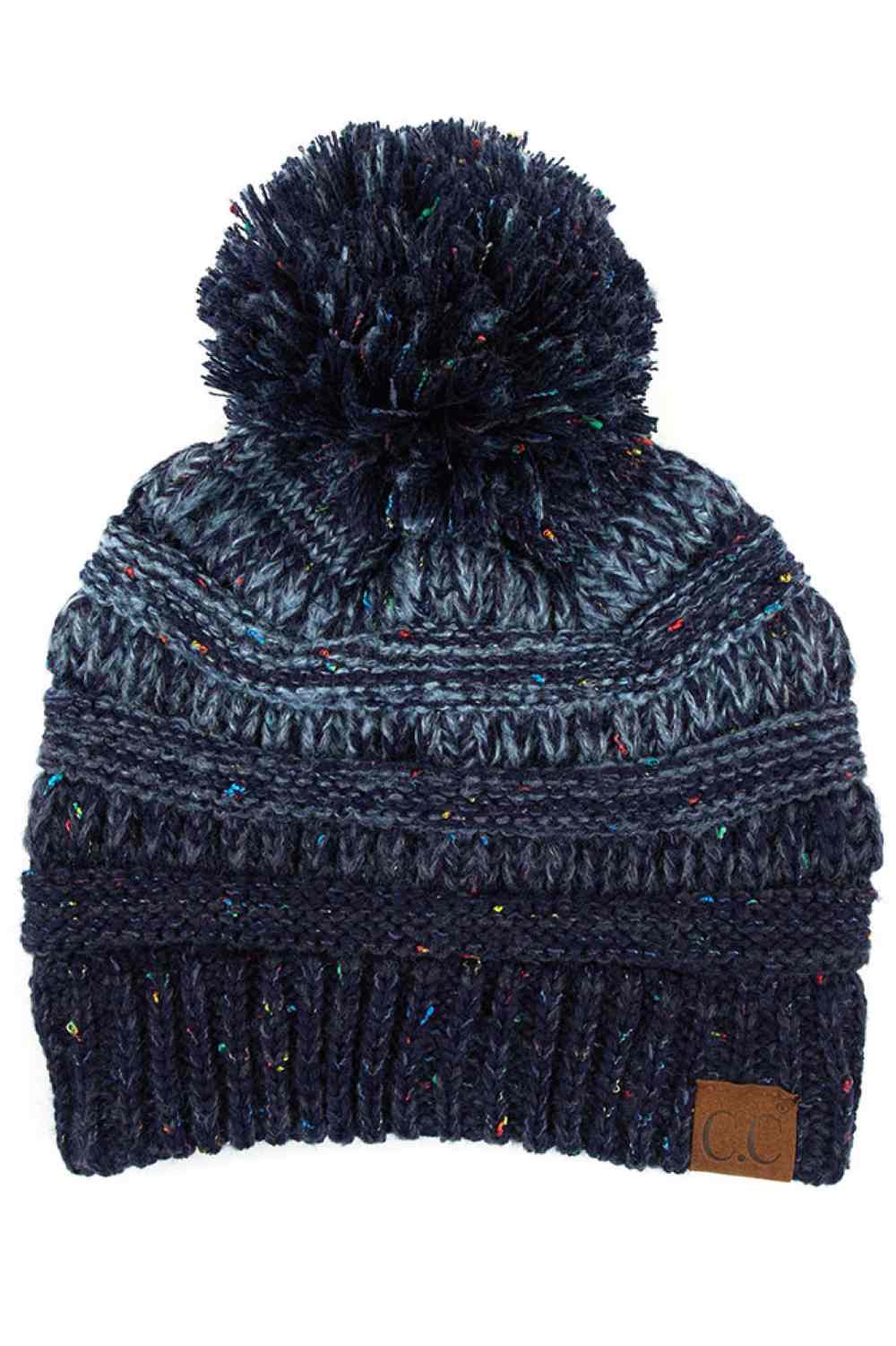 Navy Wrap yourself in cozy style with the C.C Ombre Beanie with Pom Pom. Made from 100% soft acrylic, this lightweight knit delivers warmth without the weight, making it ideal for layering or standalone wear.