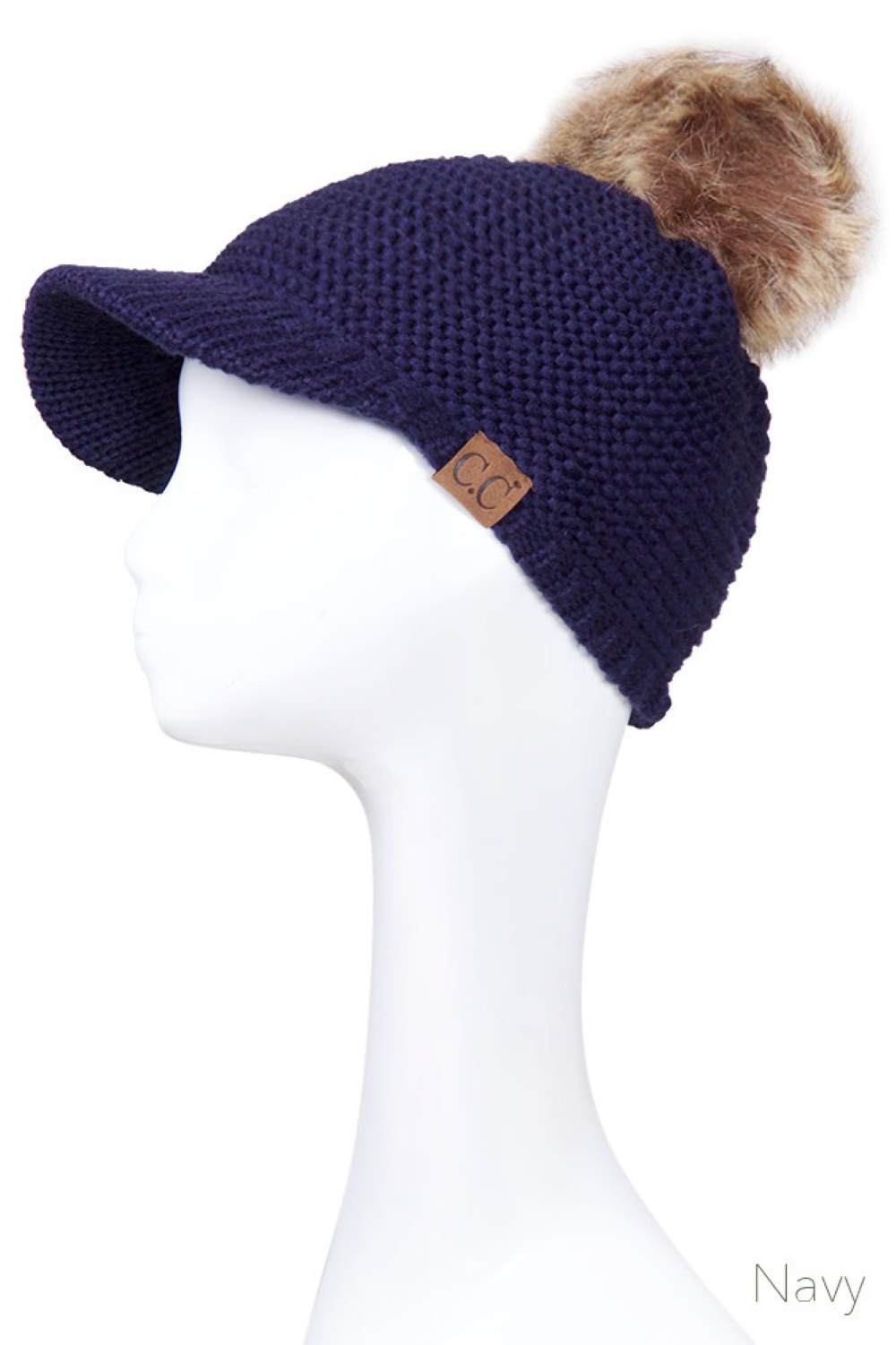 Navy Elevate your winter wardrobe with this versatile C.C knit brim beanie, crafted from 100% soft acrylic for exceptional comfort and durability. The signature knitted brim design pairs beautifully with a plush fur pom pom, adding a touch of sophistication to any cold-weather look. One size fits most, making it an effortless accessory choice for anyone seeking warmth without compromising on style. Perfect for layering or standalone wear, this beanie delivers both functionality and fashion