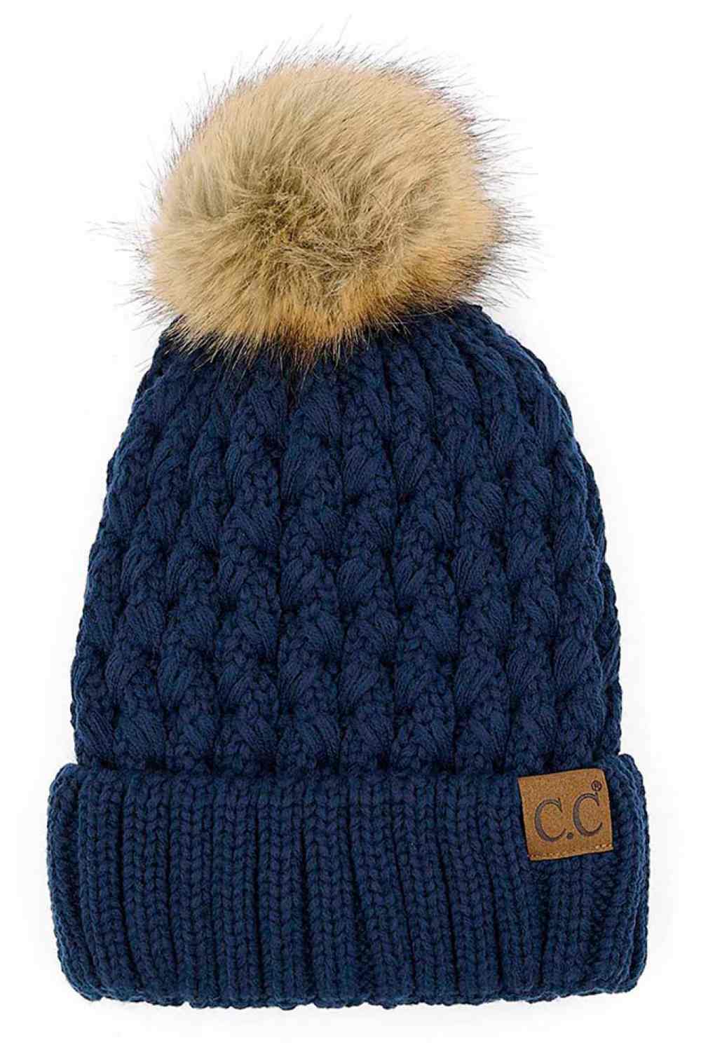 Navy Elevate your winter wardrobe with the C.C Lattice Crossover Stitch Beanie, featuring an intricate lattice pattern and cozy pom detail. Crafted from 100% soft acrylic, this beanie delivers warmth and comfort without the weight. The crossover stitch design adds visual interest while the relaxed fit suits most face shapes. Perfect for layering over your favorite winter looks, this versatile beanie transitions effortlessly from casual outings to outdoor adventures. One size fits most for easy, everyday wea