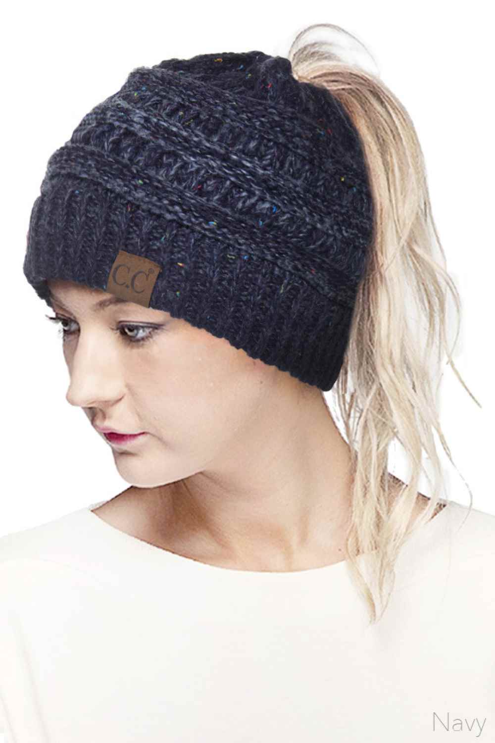 Navy Stay cozy and stylish with the C.C Ombre Confetti Messy Bun Ponytail Beanie. Crafted from 100% acrylic, this versatile beanie features a trendy messy bun opening that lets you wear your hair down while staying warm. The soft, stretchy fabric provides all-day comfort and durability, making it perfect for casual outings or outdoor adventures.&nbsp;