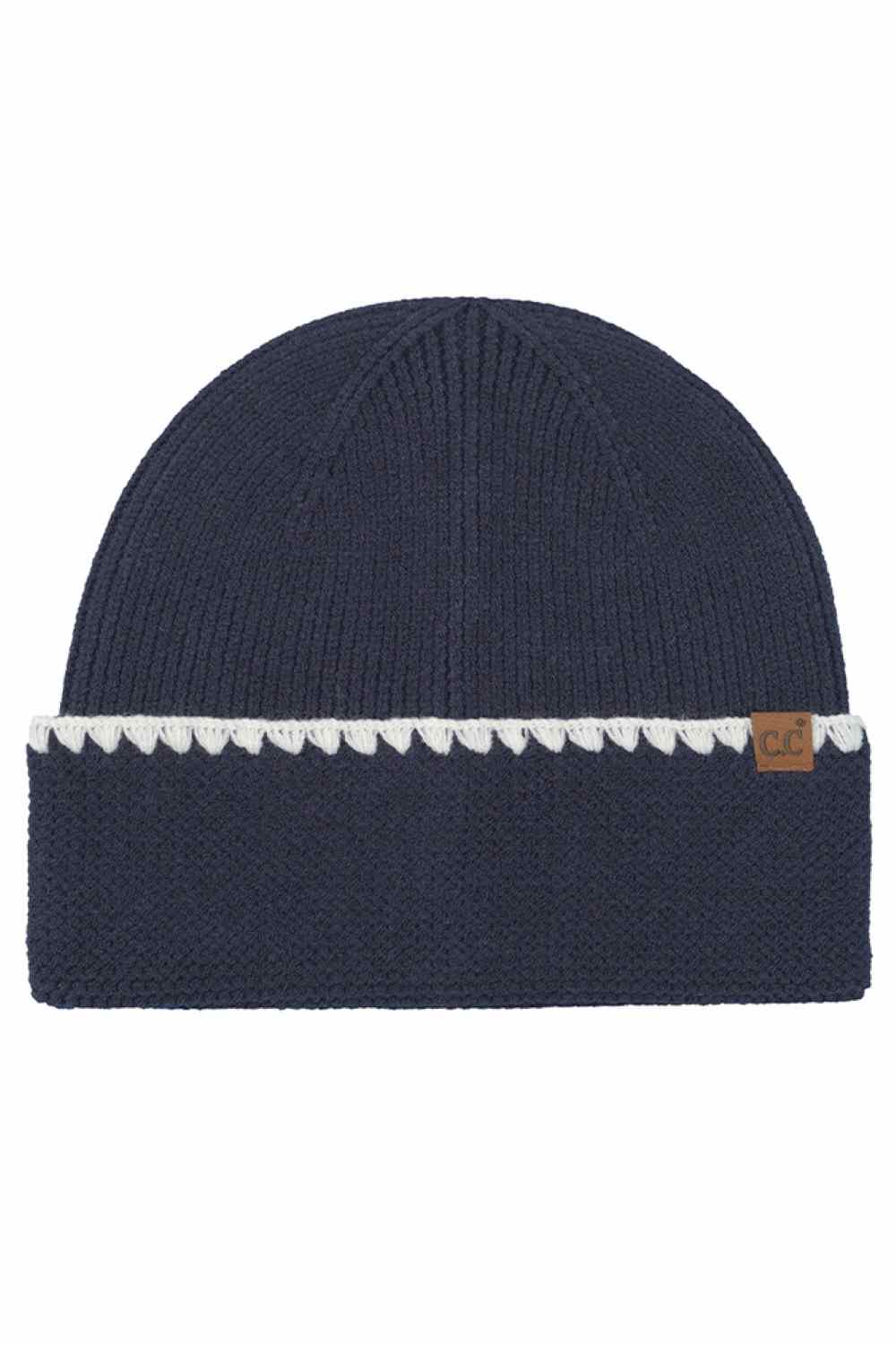 Navy  C.C Solid with Stitch Lined Cuff Beanie Winter Hat features a clean solid knit design with subtle stitch-lined cuff detailing for a polished winter look. Crafted with a soft stretch fit, it keeps you warm and comfortable while adding understated style to your cold-weather outfits.