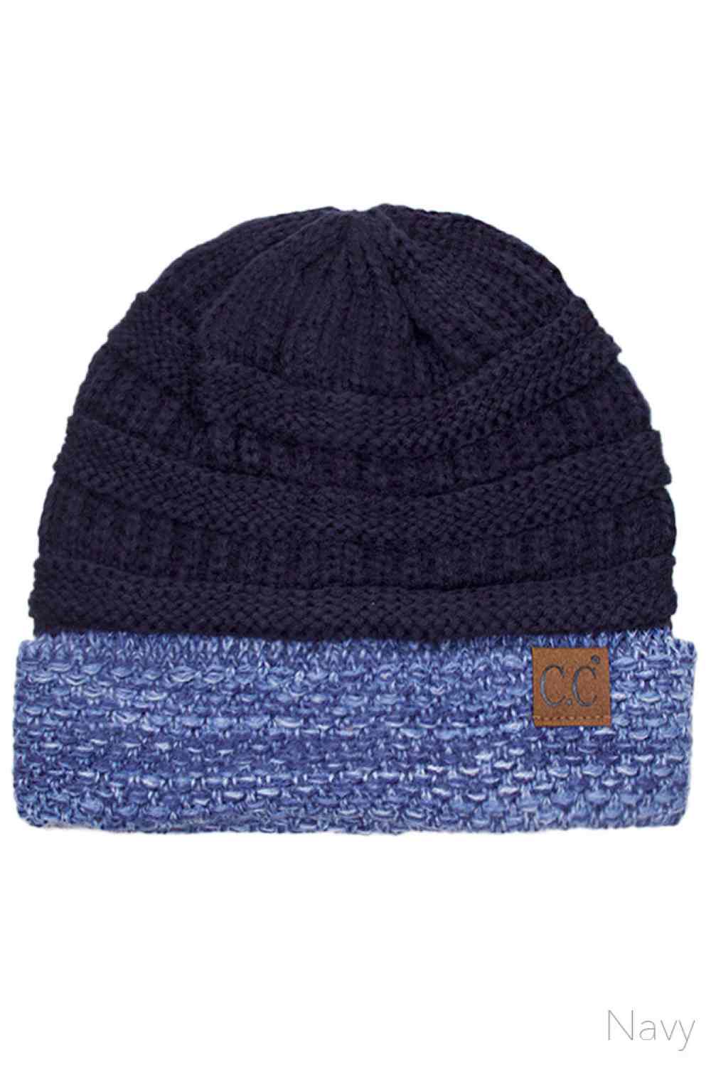 Navy The C.C Two Tone Cable Knit Beanie delivers cozy warmth with a classic aesthetic. Made from 100% acrylic, this durable beanie features a comfortable cuff design perfect for everyday wear.