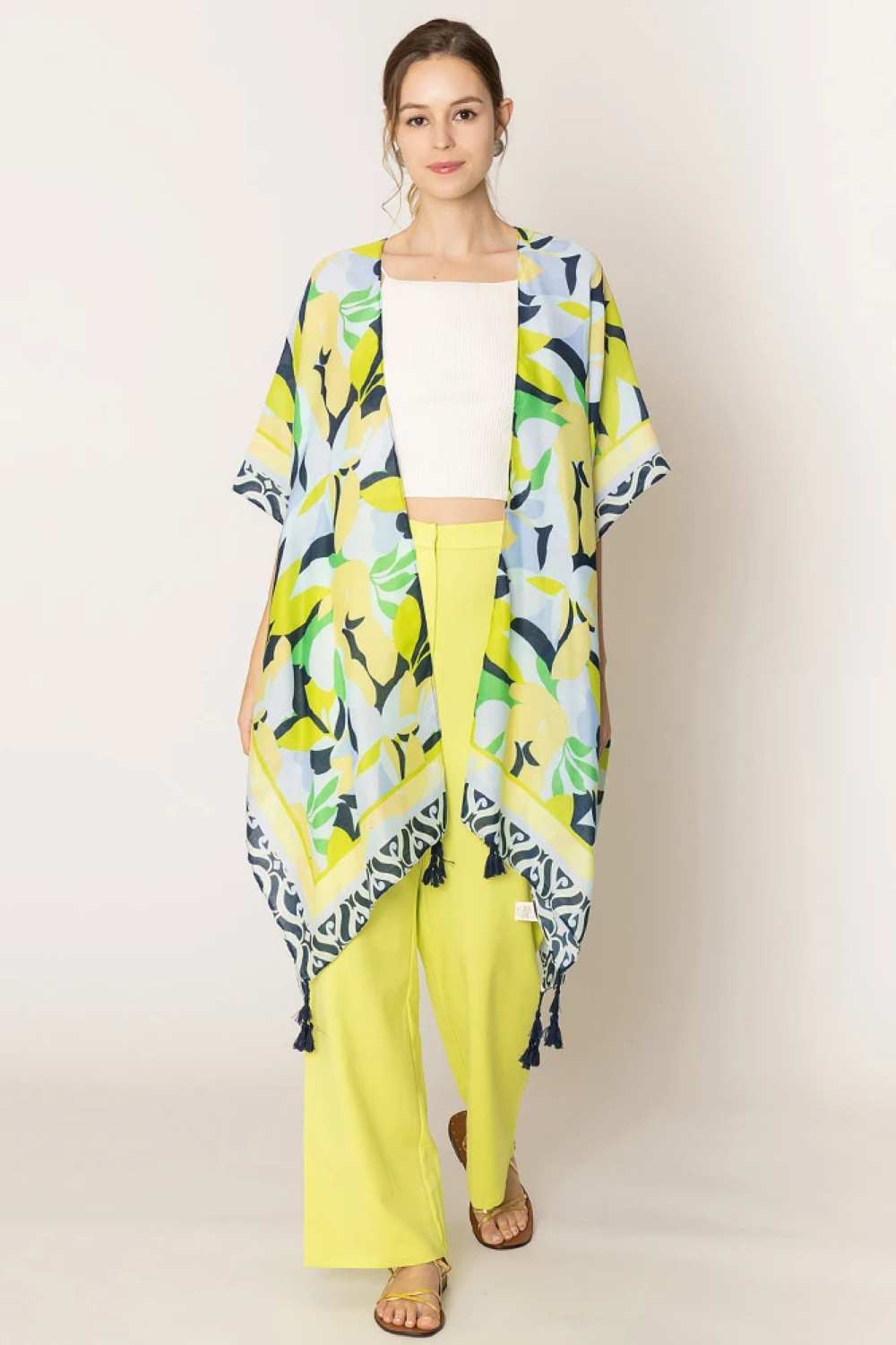 Navy Embrace effortless elegance with this stunning Floral Print Tassel Kimono. Crafted from lightweight 100% polyester, this versatile piece features a vibrant floral design and charming tassel details that add movement and flair to any outfit. With generous dimensions of 35.4" x 35.4", it drapes beautifully over dresses, swimwear, or casual wear for a relaxed, bohemian aesthetic. Perfect for layering during warmer months or adding texture to your everyday style.