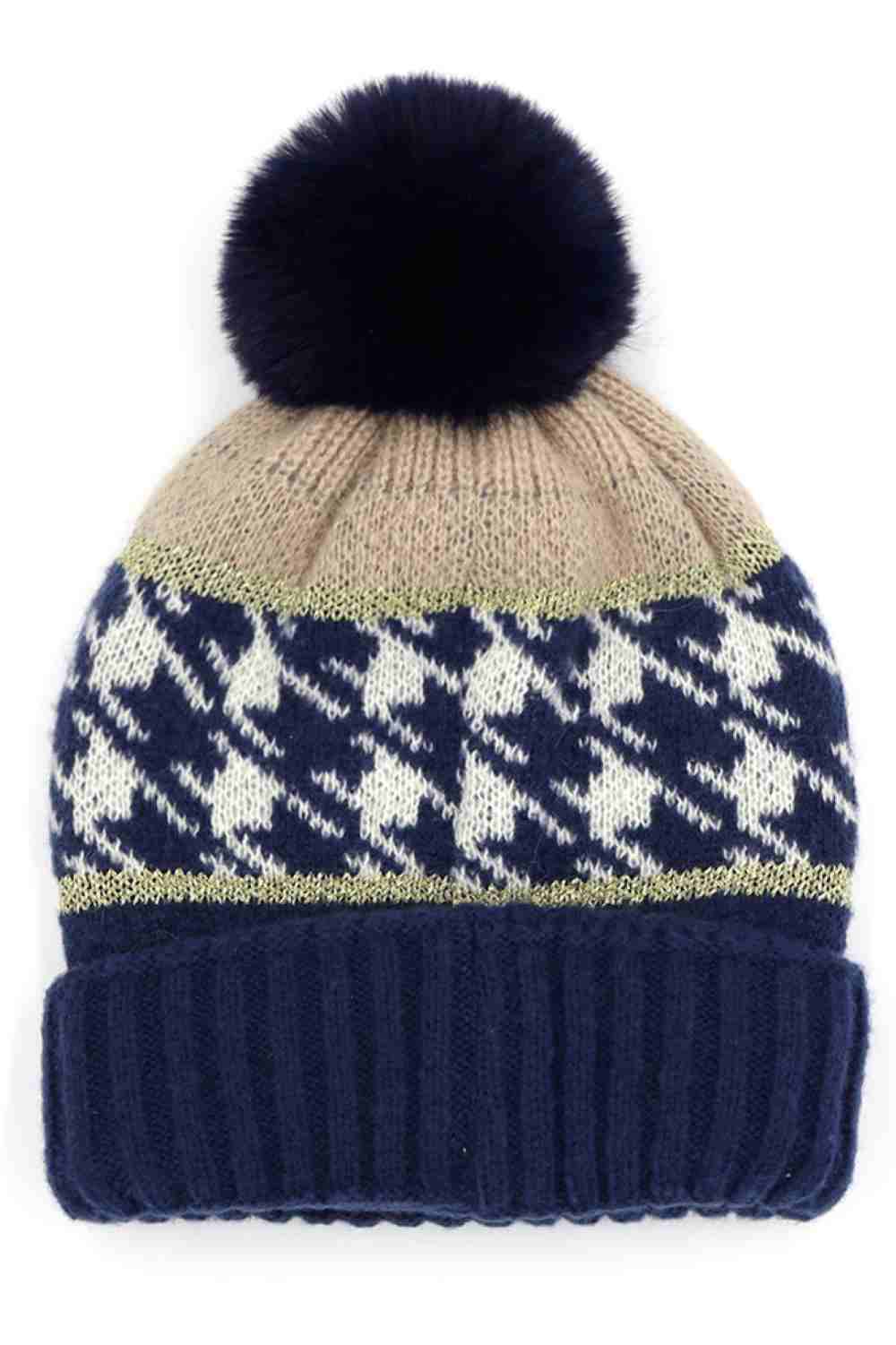 Navy Houndstooth PomPom Beanie features a classic houndstooth knit pattern topped with a fluffy pom for a stylish, winter-ready look. Finished with a soft stretch fit, it keeps you warm and comfortable while adding timeless charm to your cold-weather outfits.