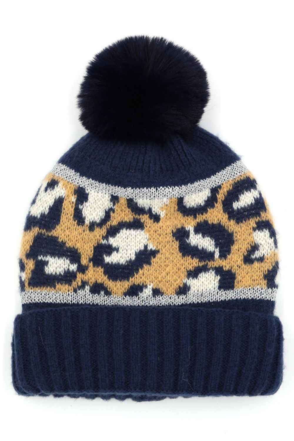 Navy Leopard PomPom Beanie features a bold leopard print design topped with a fluffy pompom for a trendy, winter-ready look. Made with a soft stretch fit, it delivers cozy warmth while adding stylish flair to your cold-weather outfits.