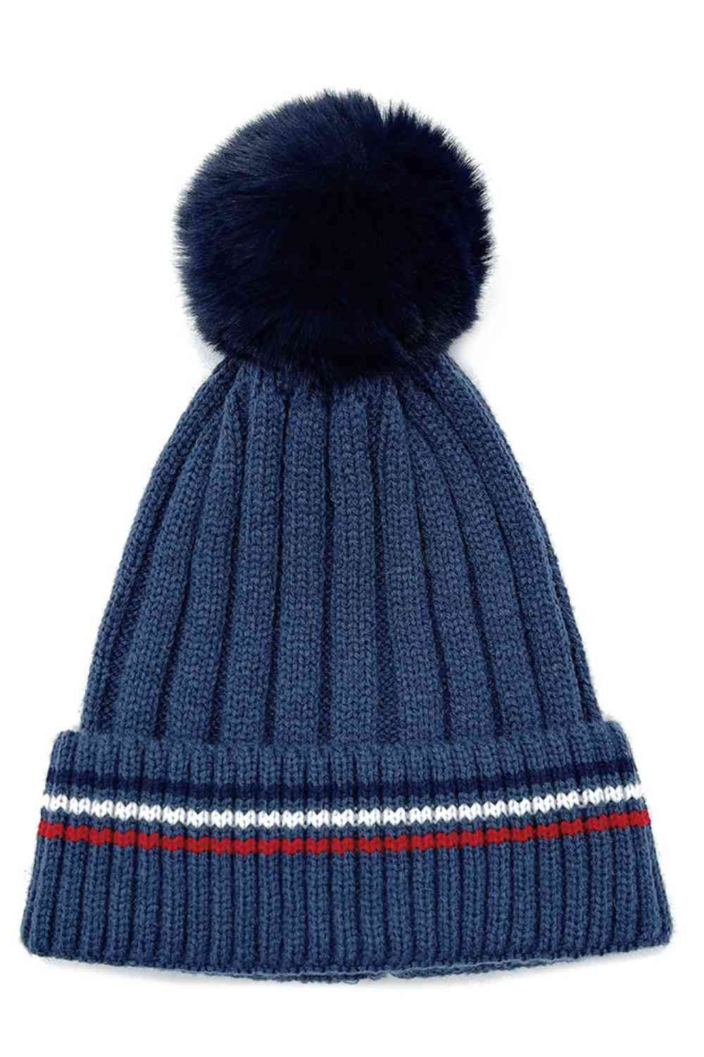 Navy Add a cozy-chic touch to your winter wardrobe with this Stripe Rib Super Soft Cuff Beanie, designed for warmth and everyday comfort. Finished with a luxurious faux fur pom, it delivers a stylish look while keeping you snug on colder days.