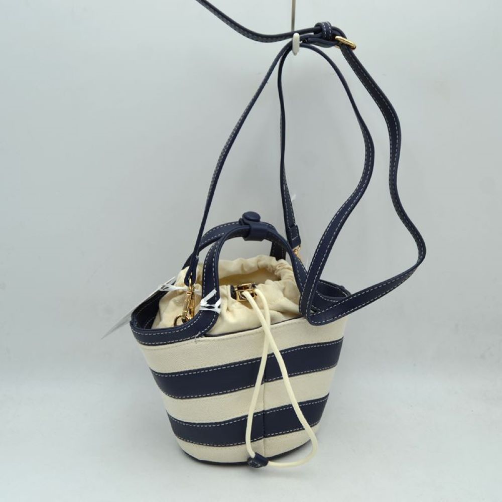 Navy Add a touch of playful charm to your everyday look with this chic striped mini bucket bag. Blending casual canvas texturing with clean, structured contrasting trim, this bag offers a contemporary twist on the classic nautical aesthetic. Perfect for casual weekend outings, summer travel, or day trips, its compact bucket silhouette keeps you organized while standing out as a statement accessory