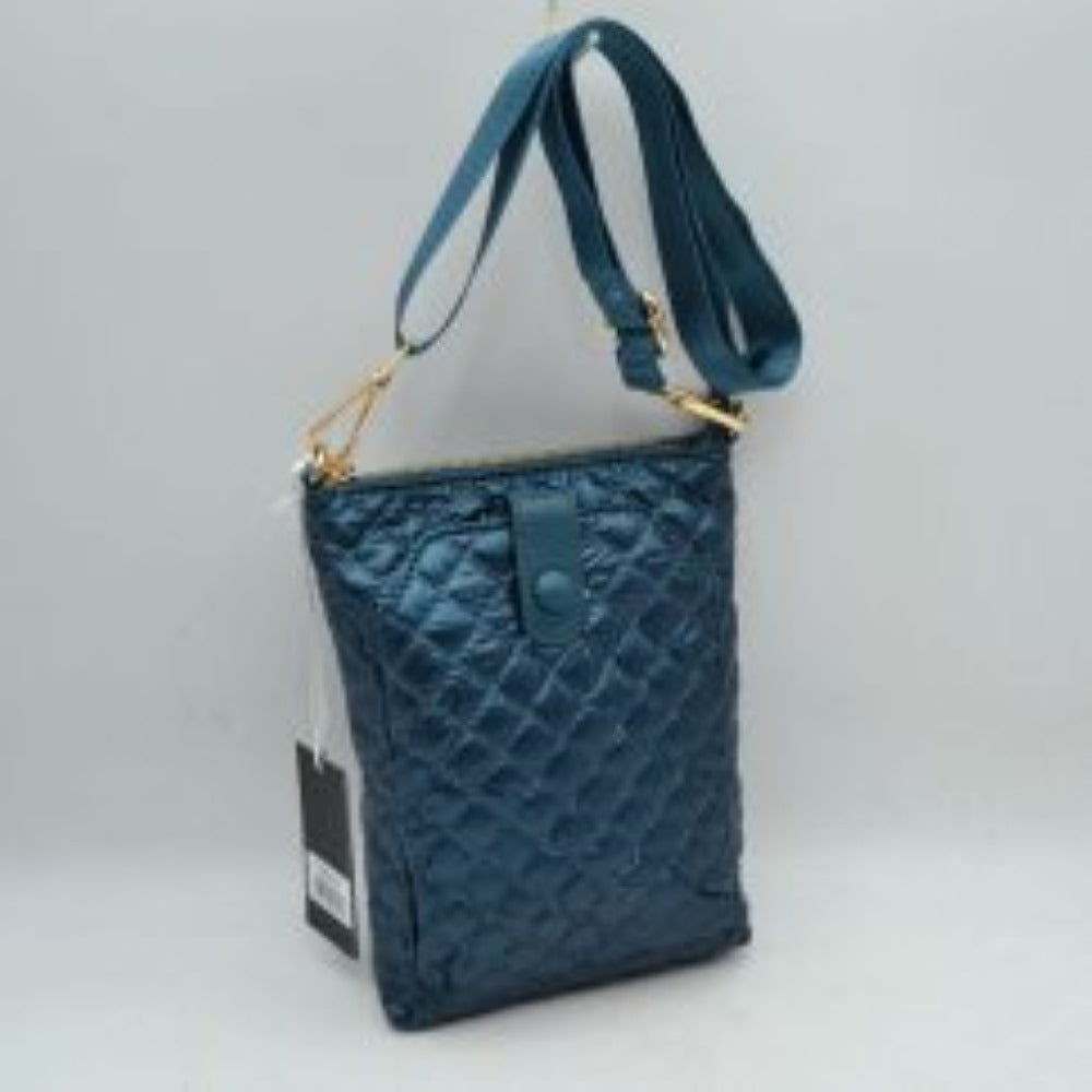 Navy-blue This functional vertical crossbody pouch bag is designed for organized everyday use, featuring a classic diamond-quilted exterior texture. The front panel includes a dedicated secondary storage compartment secured by a central vertical tab with a snap button closure for quick access to essentials. A secure top zipper opening keeping the main compartment safe is accented with polished metallic hardware