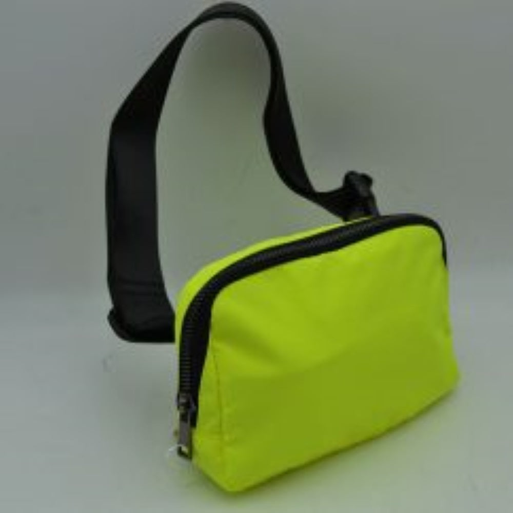 Neon green This minimalist bag features a smooth, clean design ideal for versatile everyday use. The main storage compartment is secured by a curved top zipper with dual pulls for easy access to essentials. A wide, adjustable strap extends from the sides, complete with a matching slider to easily customize the fit for comfortable carrying.
