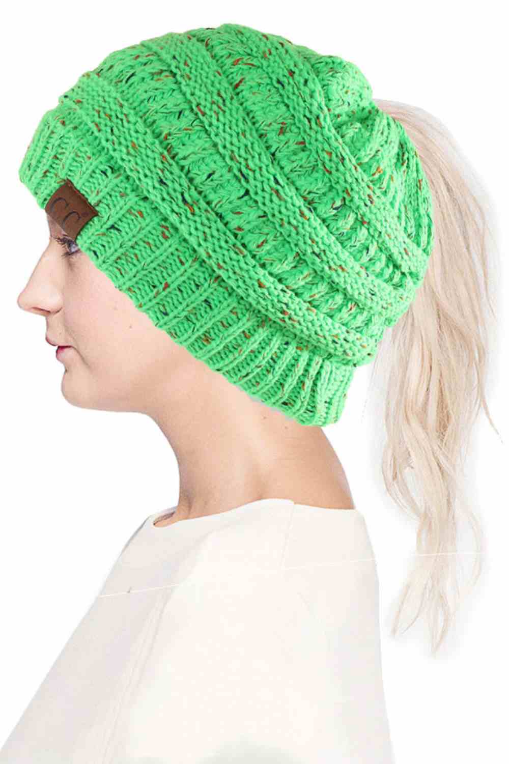 Neon Lime The C.C Confetti Ponytail Messy Bun Beanie features a soft knit design with subtle confetti flecks for a fun, playful look. Designed with a convenient opening for ponytails or messy buns, it keeps you warm while allowing you to style your hair comfortably.