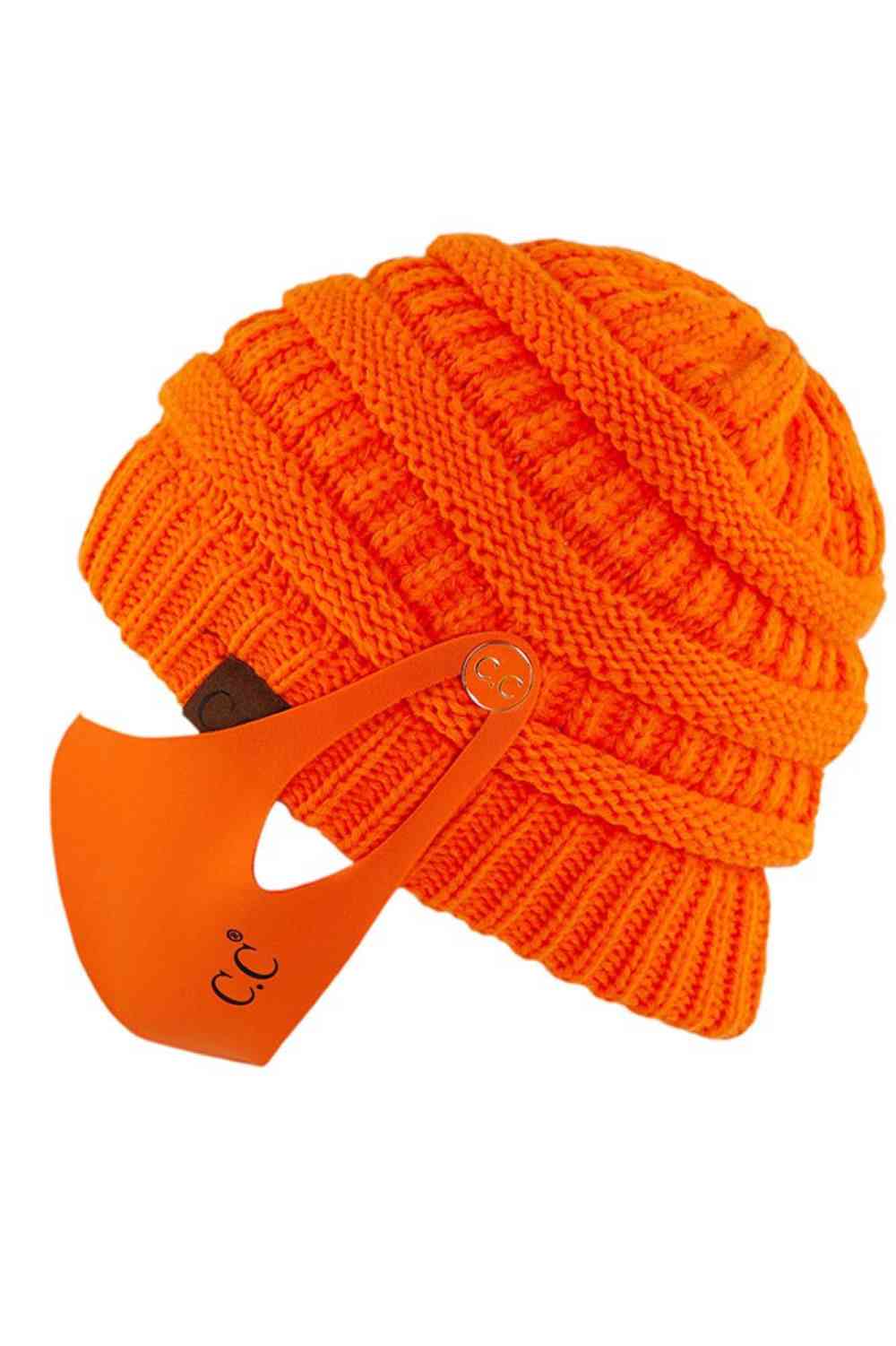 Neon Orange Stay warm and functional with this C.C Ribbed Knit Beanie featuring a convenient button attachment for your mask. Crafted from 100% acrylic, this lightweight beanie offers soft comfort and durability for everyday wear.