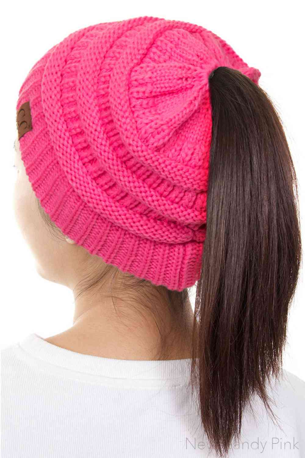 New Candy The C.C Solid Color Ponytail Messy Bun Beanie combines comfort with versatility for effortless everyday style. Crafted from 100% soft acrylic, this beanie features an open crown design that accommodates ponytails and messy buns while keeping you warm. The one-size-fits-most construction ensures a secure, flattering fit for virtually anyone. Perfect for casual outings, workouts, or relaxed weekends, this practical accessory transitions seamlessly from season to season.
