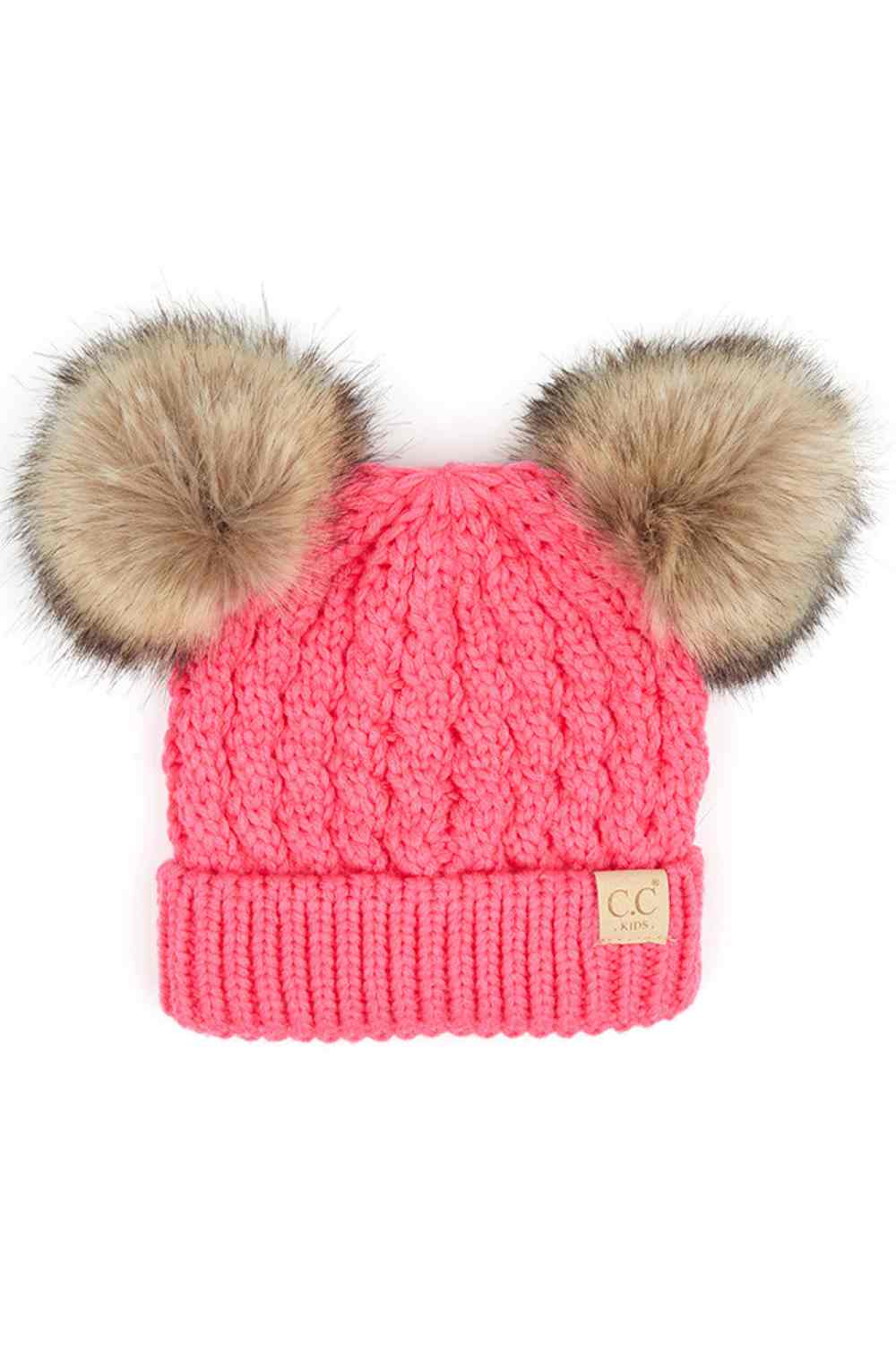 New Candy Pink Keep your child warm and stylish with this C.C Kids Double Pom Pom Beanie. Featuring an all-over cable knit pattern and dual pom poms for extra charm, it's the perfect accessory for chilly days.