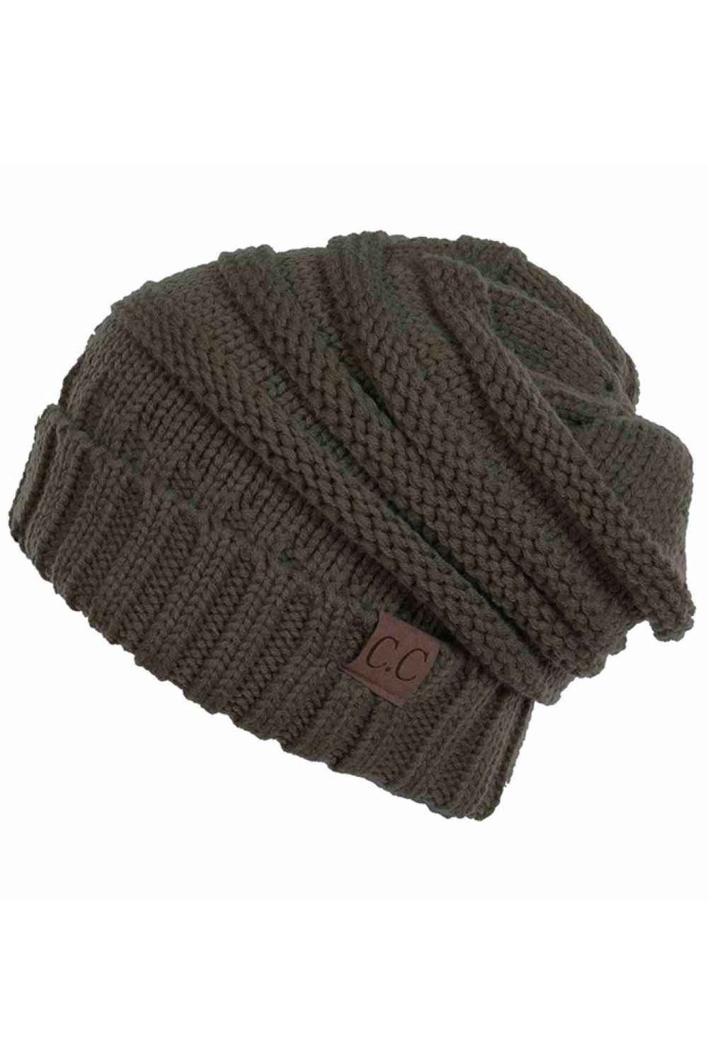 New Olive Wrap yourself in warmth with this C.C Slouchy Knitted Beanie, crafted from 100% soft acrylic for ultimate comfort. The oversized silhouette and plush pom pom detail create a relaxed, on-trend look perfect for chilly days. Available in nine versatile colors—Beige, Berry, Dark Denim, Heather Gray, Ivory, Pistachio, Rose, Steel Blue, and Violet Purple—this beanie pairs effortlessly with any winter wardrobe. The ribbed knit construction ensures durability and a flattering fit.