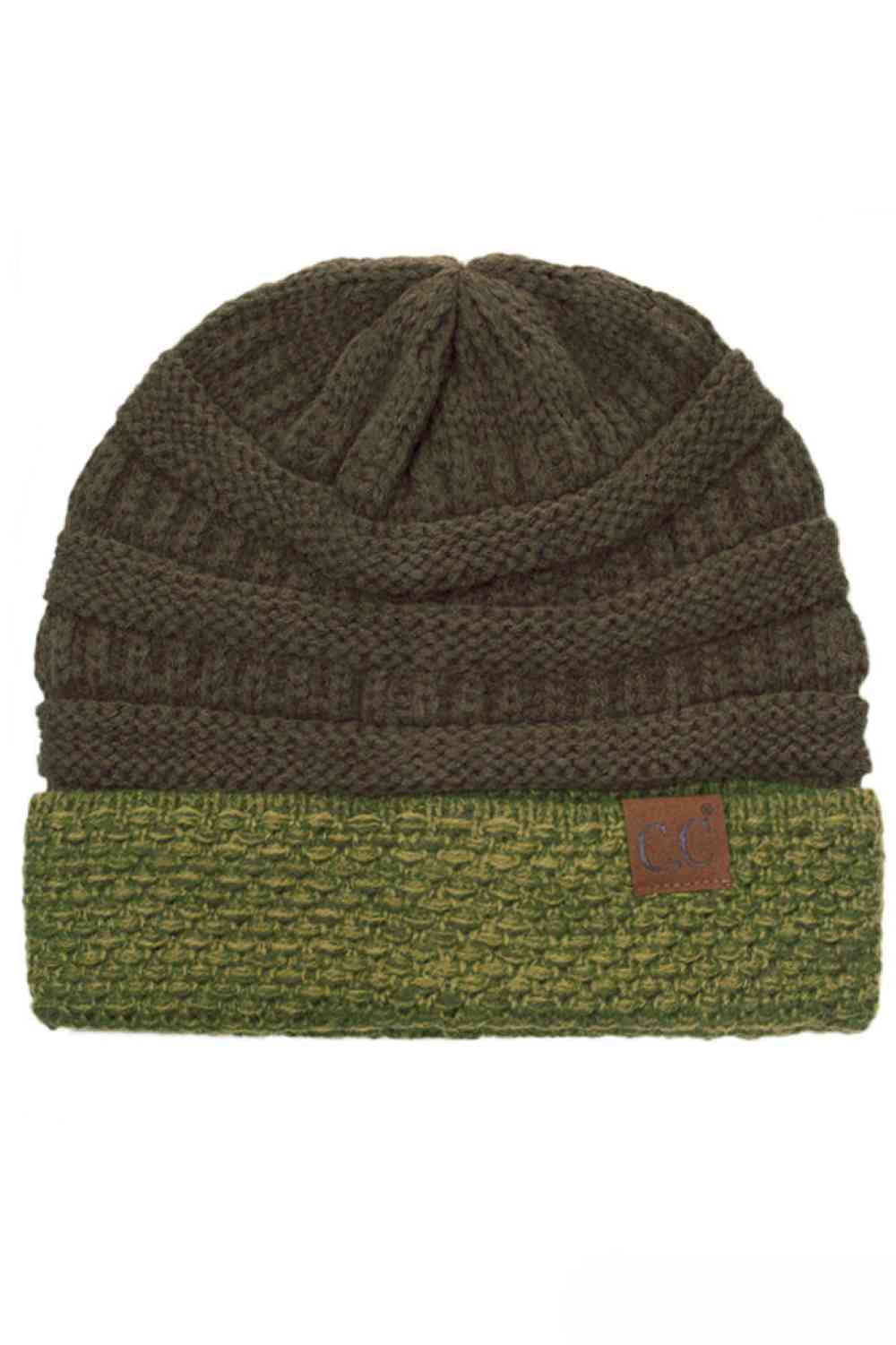 New Olive The C.C Two Tone Cable Knit Beanie delivers cozy warmth with a classic aesthetic. Made from 100% acrylic, this durable beanie features a comfortable cuff design perfect for everyday wear.